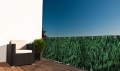 Brise-vue de balcon sur mesure avec graphisme d'une forêt de conifères verte et dense turn up