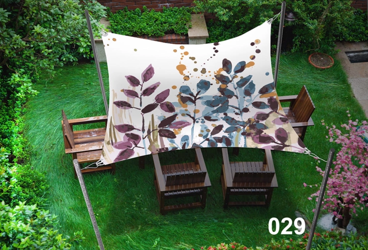 Voile d'ombrage imperméable 3x5 m avec motif floral au-dessus de meubles en bois sur une pelouse