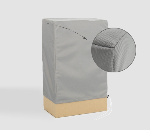 Housse de protection grise pour meubles de jardin en gros plan montrant la structure du matériau et les coutures renforcées