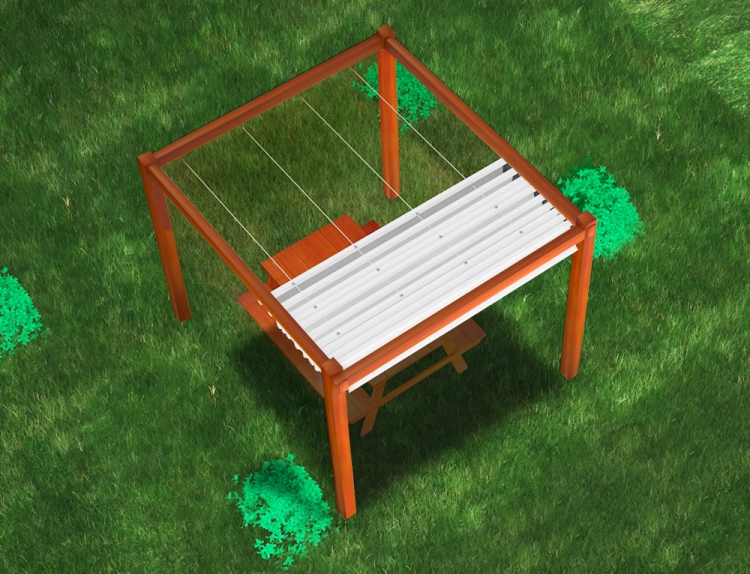 Kit de store bateau monté sur une pergola de jardin en bois au-dessus d'une table de pique-nique marron sur l'herbe