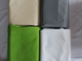 Comparaison des couleurs de tissus pour voile d'ombrage : beige, graphite, vert et blanc, matériau imperméable Premium