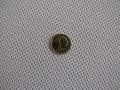 Bílá sluneční clona pro římskou roletu s mincí 1 groš ukazující hustou vazbu materiálu
